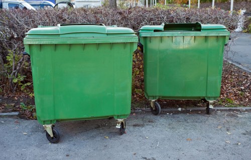 Workers sorting recyclables into separate containers at a commercial facility