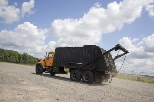 Depot staff sorting business waste into labeled containers